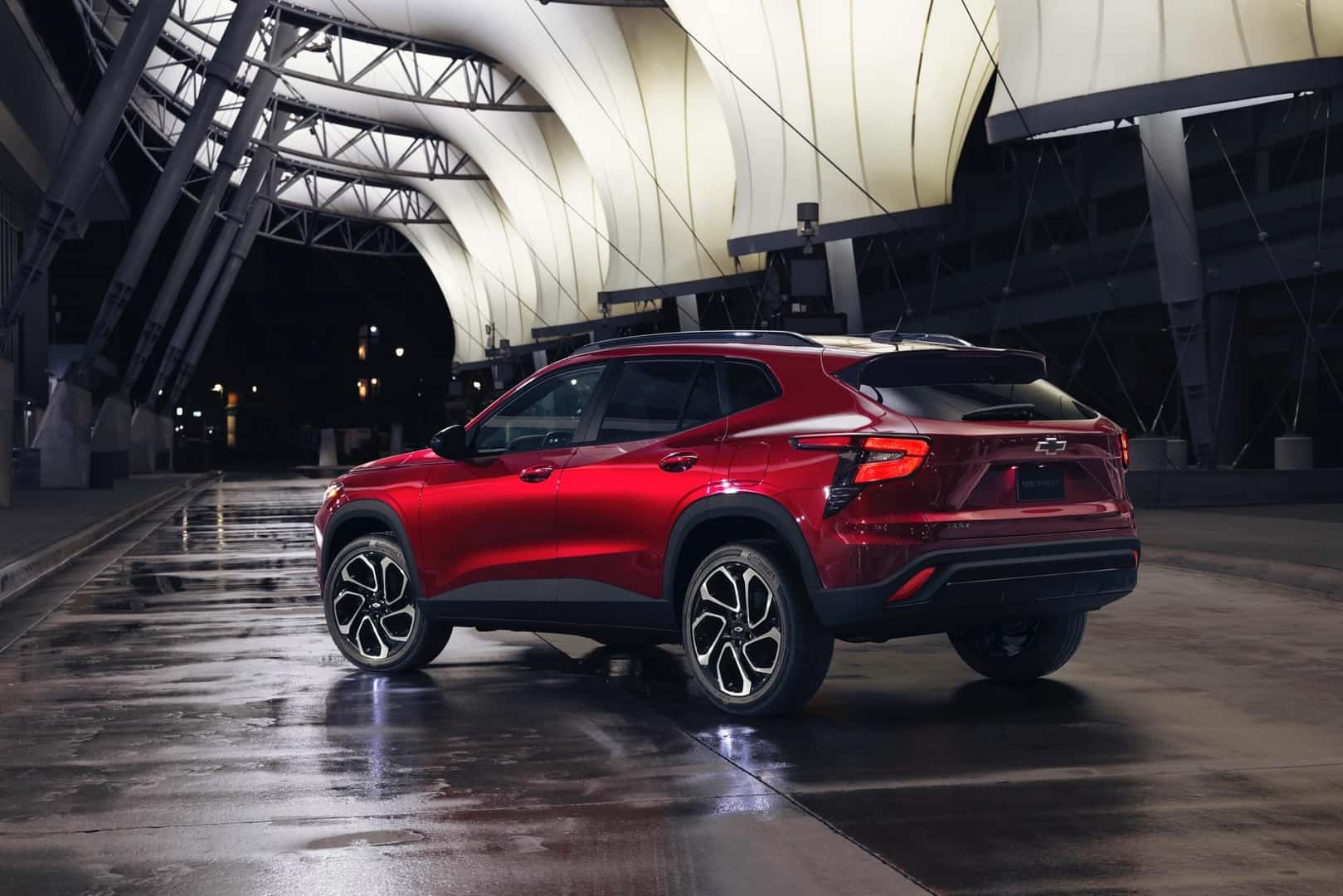 2025 Chevrolet Trax RS Crimson Metallic driver and rear view 