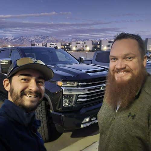 Kellan, from Cottonwood Heights, Utah, with Product Specialist Antonio 'Tony' Hernandez with his freshly delivered Onyx Black 2015 GMC Sierra 2500HD Denali.