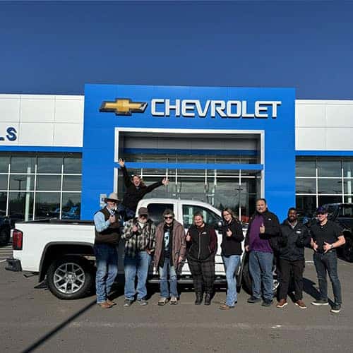 Mary Lou & Orville, from Rupert, Idaho, with their Summit White 2018 GMC Sierra 1500 SLT and Product Specialist Brian Walker at Twin Falls Idaho's Twin Falls Chevy.