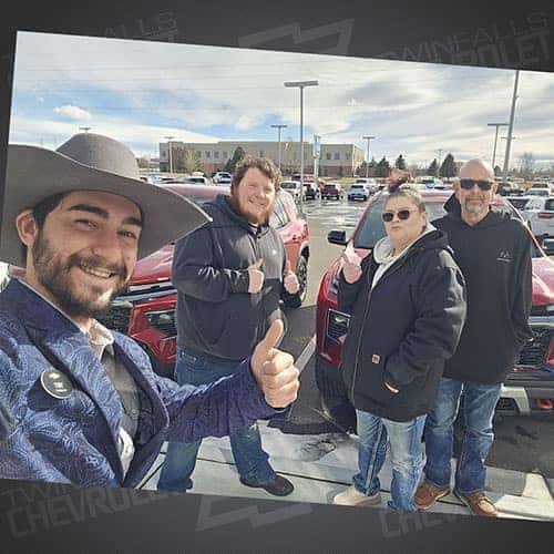 Cody, from Wells, Nevada, with his family's fresh Radiant Red Tintcoat 2025 Chevy Traverse Z71 AWD at Twin Falls Chevy, assisted by Product Specialist Antonio 'Tony' Hernandez in Twin Falls, Idaho