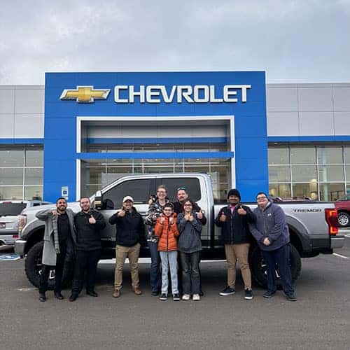 Jeremy & Samantha, from Buhl, Idaho, with their Iconic Silver 2020 Ford F-250 Lariat with the Tremor Off-Road Package outside Twin Falls Chevy. Assisted by Product Specialist Johnny Hernandez