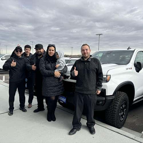 Rolberto's owners Leo & Celest from Wendover, Nevada, with their Summit White 2025 Chevy Silverado 1500 ZR2 - assisted by Product Specialist George Hilarides at Twin Falls Chevy in Twin Falls, Idaho.