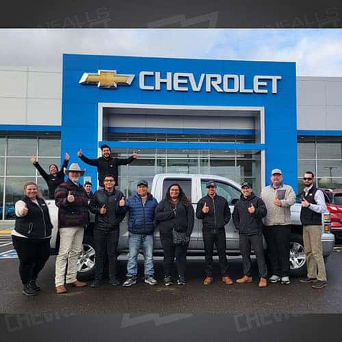 Leticia, from Buhl, Idaho with her Silver Ice Metallic 2015 Chevy Silverado 1500 1LT and Purchase Advisor Gustavo 'Goose' Ceron at Twin Falls Chevrolet.