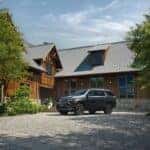 2025 Chevrolet Tahoe parked in front of a house