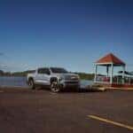 The Efficient And World Record Holder, the 2025 Chevy Silverado, Parked On A Lakeside Parking Lot, Near A Gazebo