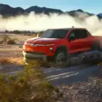 2026 Chevrolet Silverado EV Trail Boss off roading in the mountains