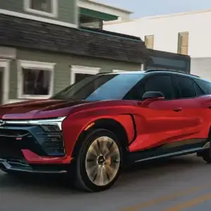 2026 Chevrolet Blazer EV SS Radiant Red Tintcoat driving in a town