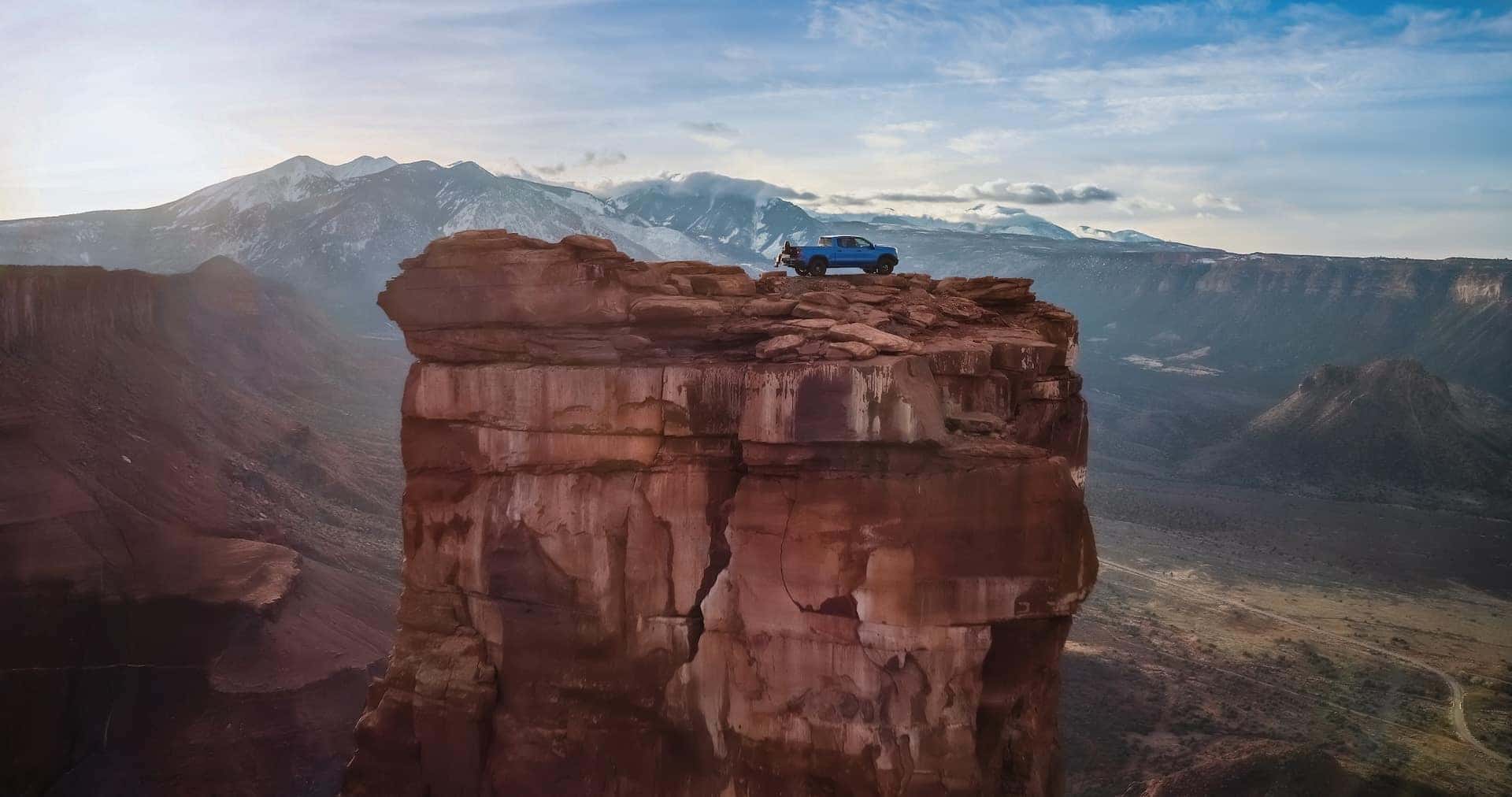 Wide Shot of the Silverado ZR2 and Brooke Lee on top of Casteton Tower in Utah