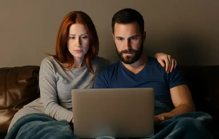 couple looking at a computer