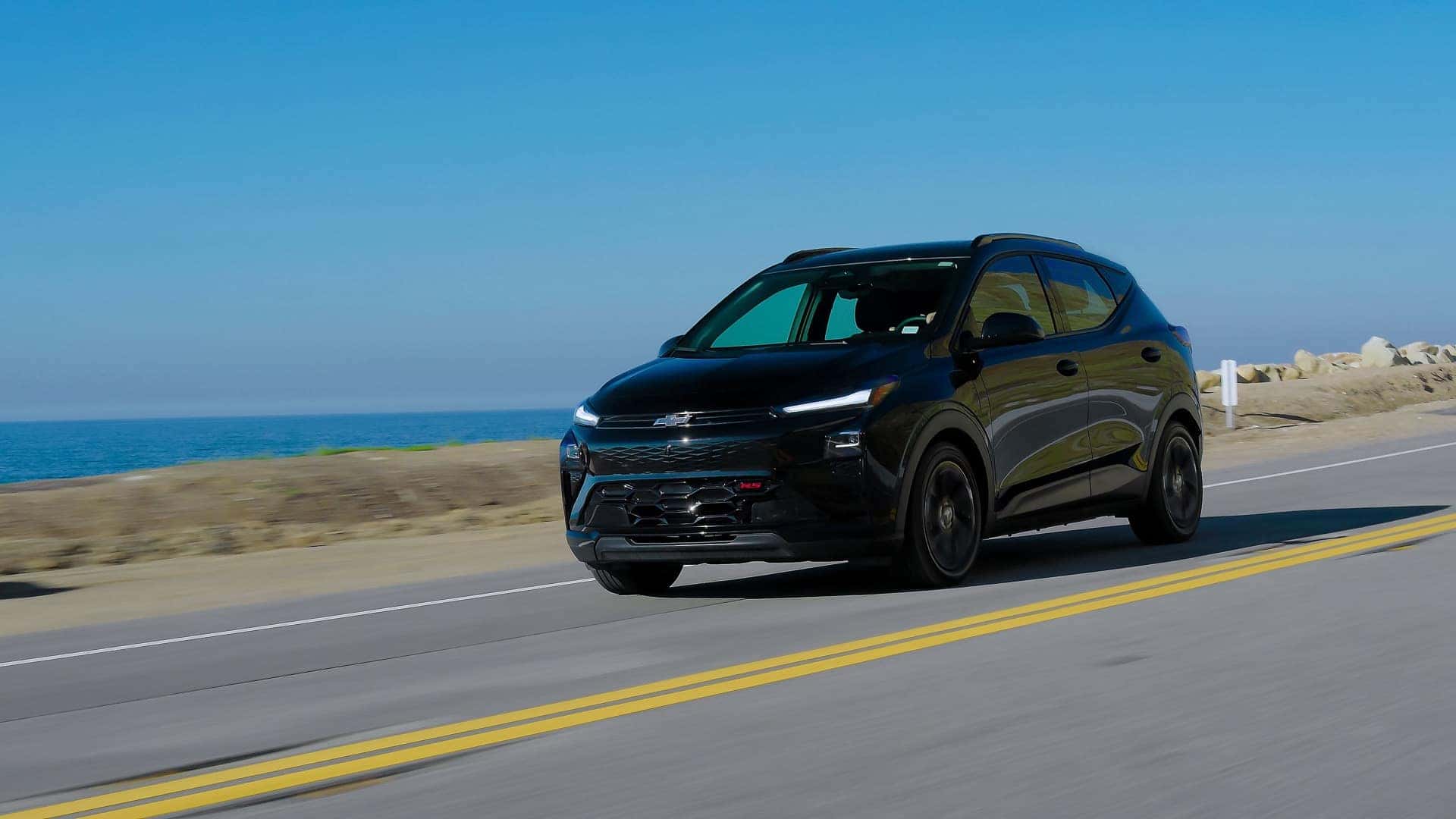 2027 Chevrolet Bolt black in motion