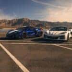 Two Fuel-Efficient 2027 Chevrolet Corvette Glistening Under The Sun At A Parking Lot