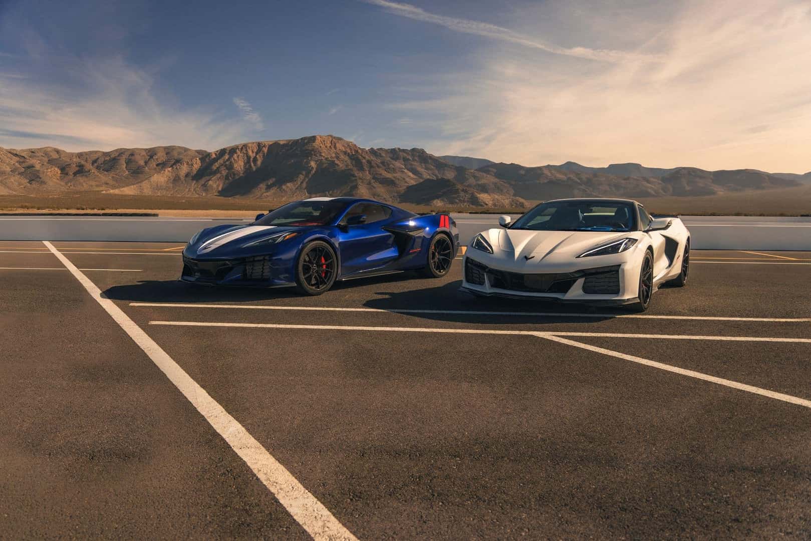 Two Fuel-Efficient 2027 Chevrolet Corvette Glistening Under The Sun At A Parking Lot