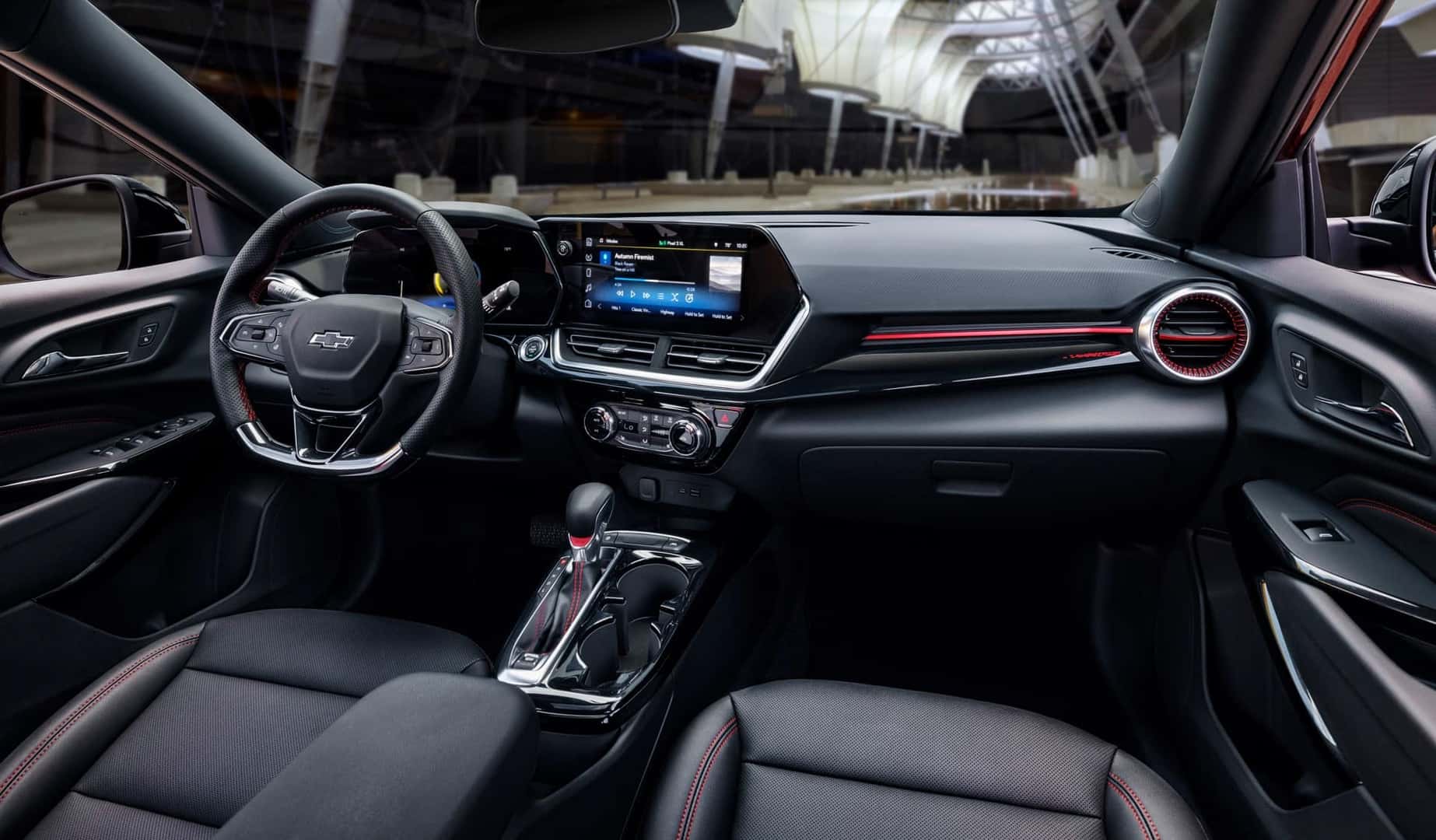 The Sleek And Black Front Interior Of The Fabulous And Dependable 2024 Chevrolet Trax
