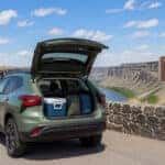 2026 Chevrolet Trax with open liftgate at the Snake River Canyon rim overlook in Twin Falls, Idaho, late-summer morning