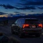 2026 Chevrolet Traverse on a rural southern Idaho road at dusk for a Halloween road trip to Albion